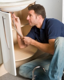 plano plumber working on sink